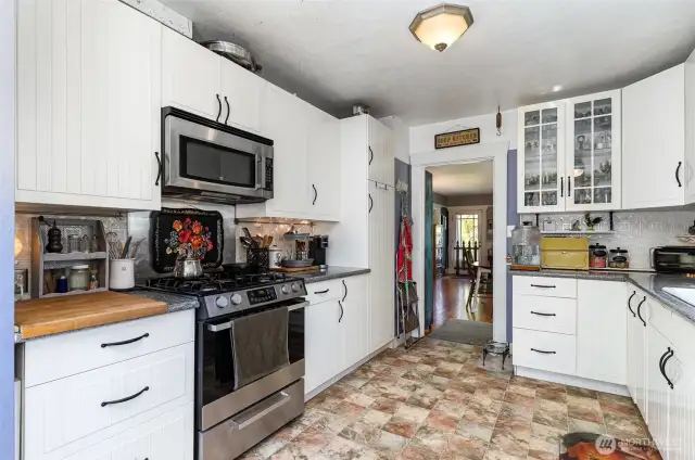 Another view of the kitchen showcasing all the cabinet storage and counter space.
