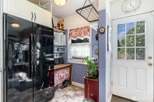 The cozy kitchen nook is perfect for a coffee bar, extra appliance storage, or even a small breakfast station!