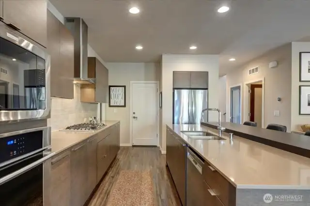 View of kitchen towards the garage door. Walk-in pantry is to the far left.