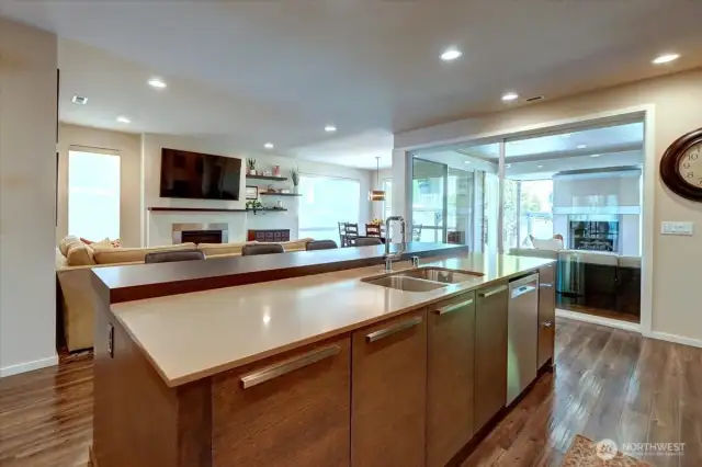 Open concept so the chef is involved! Note the oversized sliders to the covered deck with fireplace.