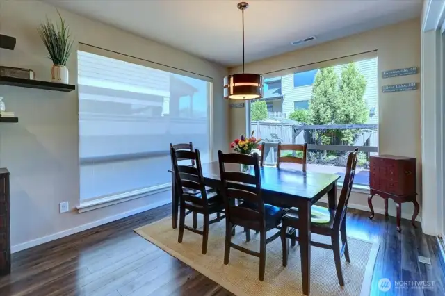 Dining area is flooded with natural light.