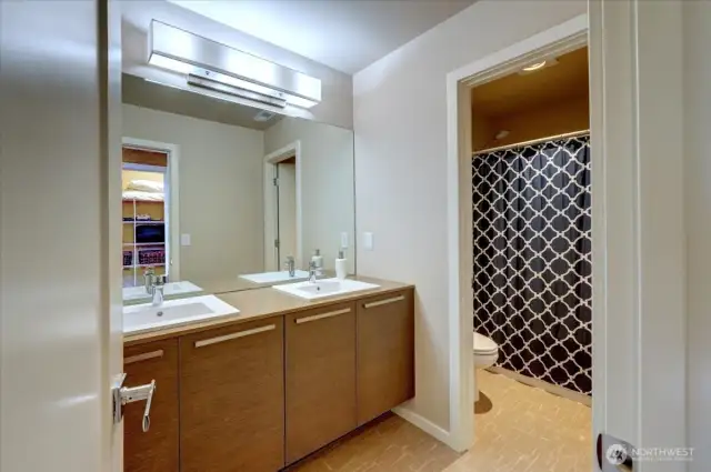 Main bath upstairs with double vanity.