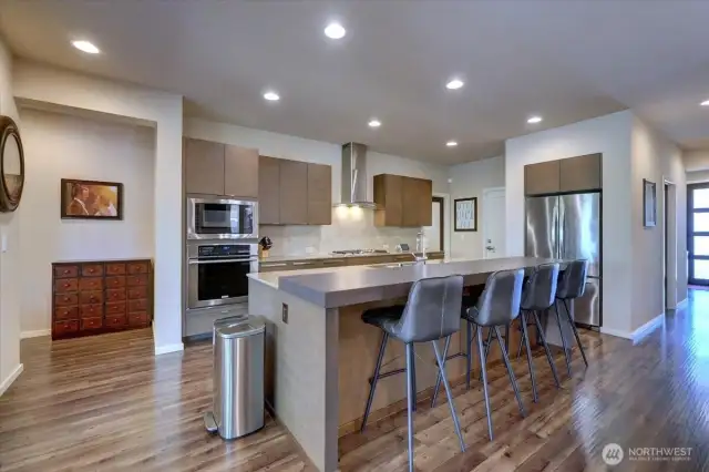 Spacious, open kitchen with large eating bar.