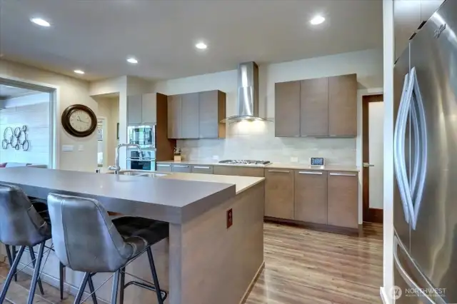 Modern kitchen with stainless steel appliances.