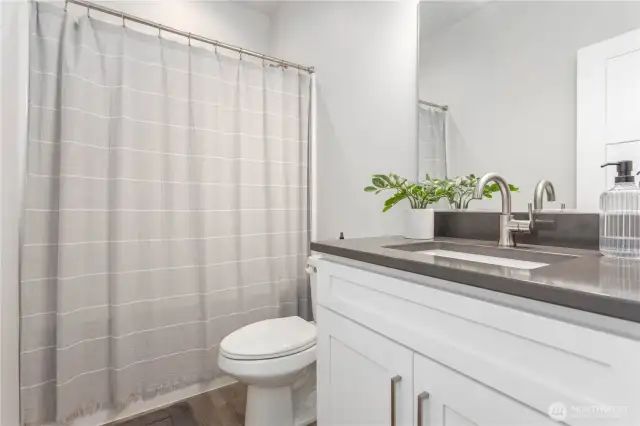 Full Bathroom with quartz countertops.
