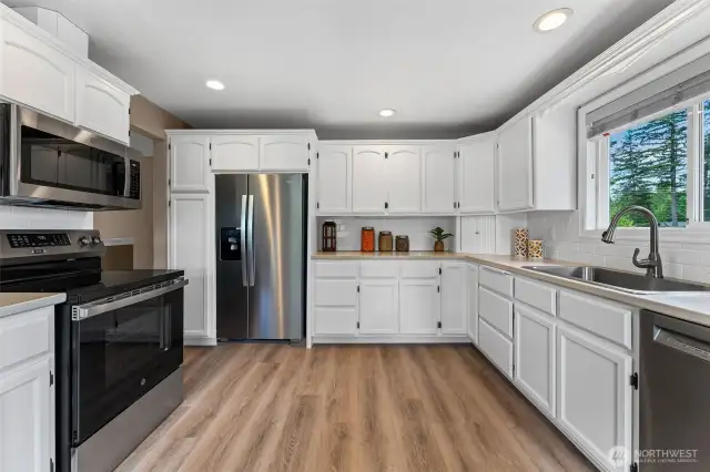 Large light filled kitchen with plenty of cabinet and counter space