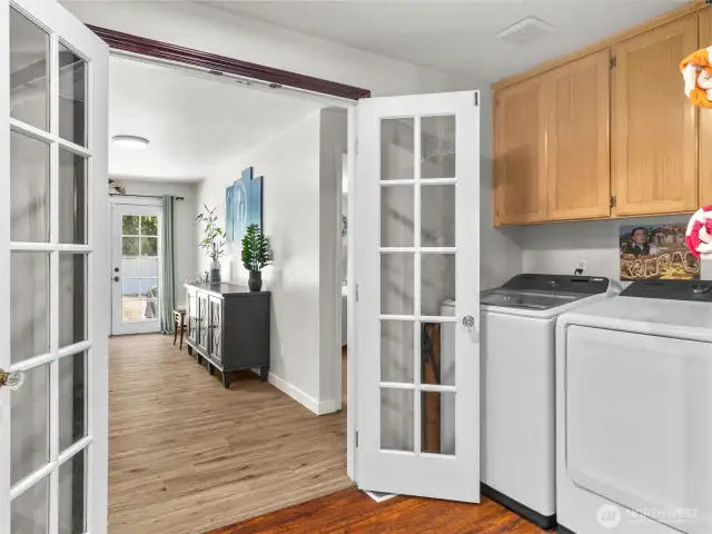 Laundry room, with pass through to the green family room from the kitchen.