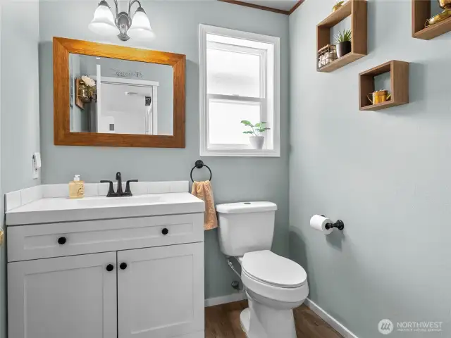 Downstairs half bathroom centrally located.