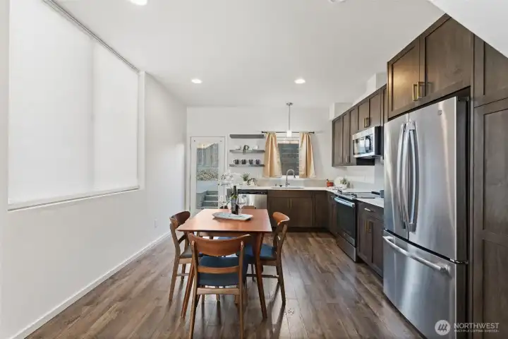 Huge window brings light into the kitchen and dining area.