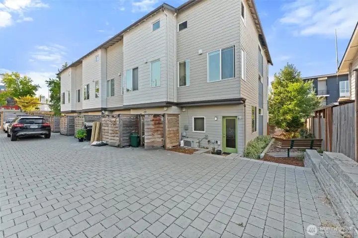 Back of home with parking area
