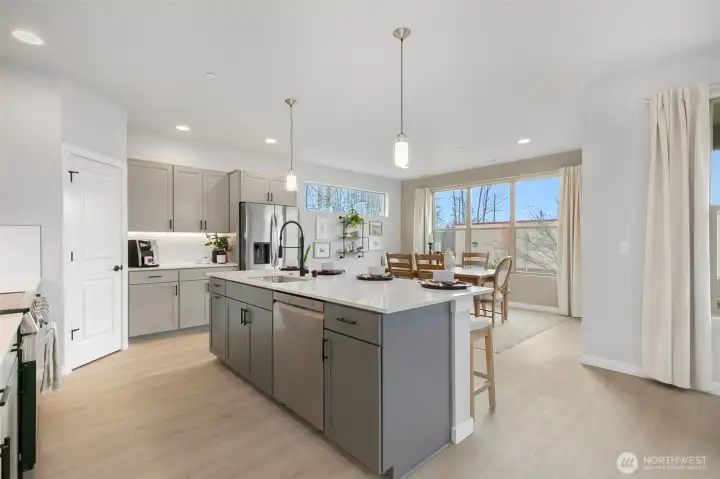 Kitchen with abundance of cabinets flow right into the spacious dining room.