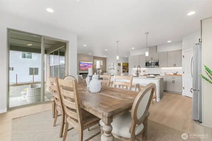 Huge sliding door opens up from the dining room to the covered deck with BBQ stub for year-round indoor-outdoor living.