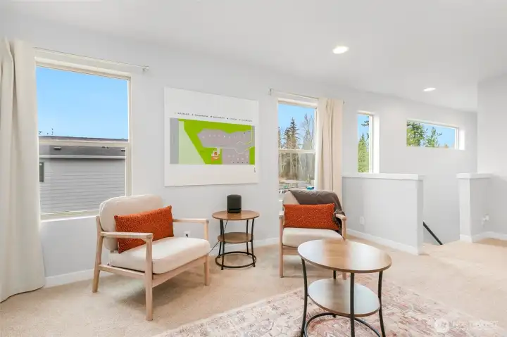 Heading upstairs, you find the versatile loft, suitable for media, office, or play room.