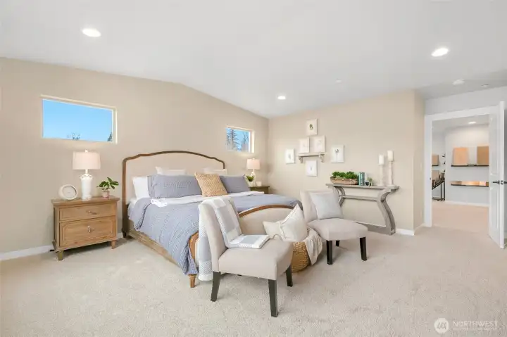 Oversized primary bedroom with vaulted ceilings is your ideal retreat after a long day.