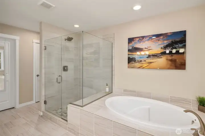 primary bedroom attached bath - note that the seamless glass shower is fully tiled. There is also a linen closet in the bath - there are actually 4 linen closets on the upper floor