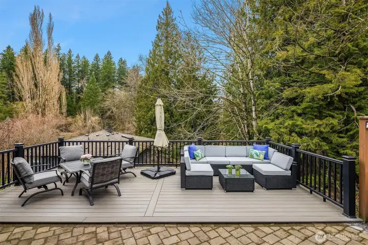 A Trex deck overlooking the greenbelt offers a tranquil setting anytime of the year