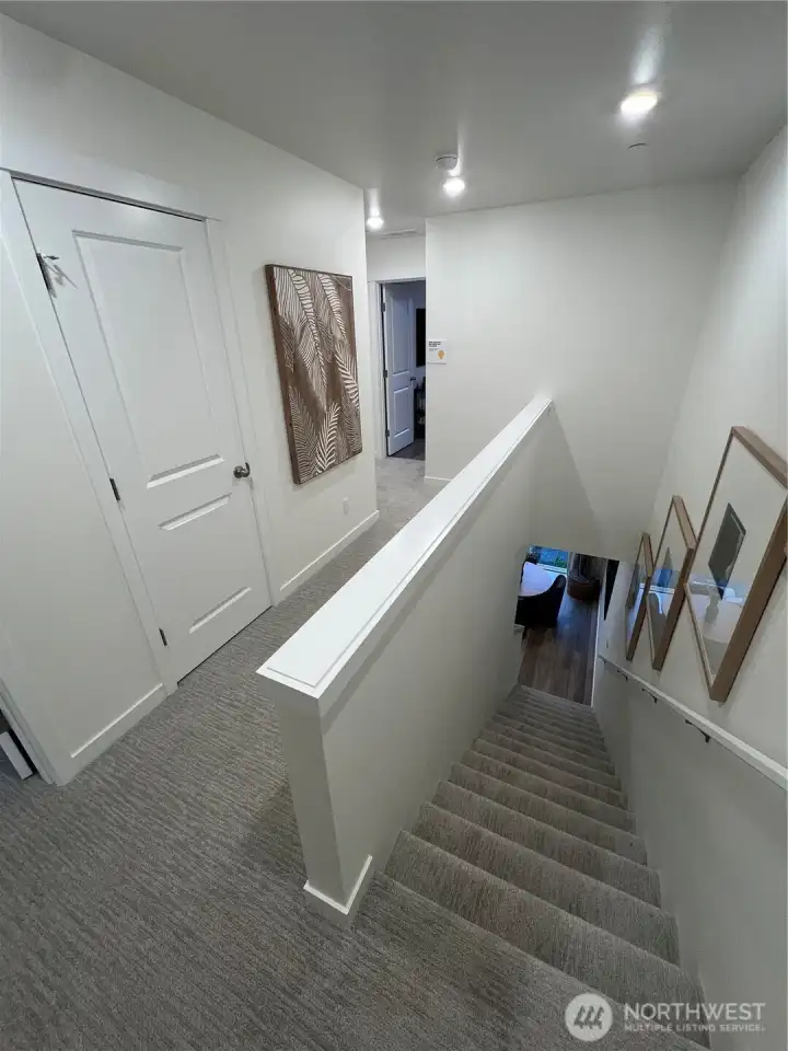Model home stairwell and upstairs hallway......specification and features may vary