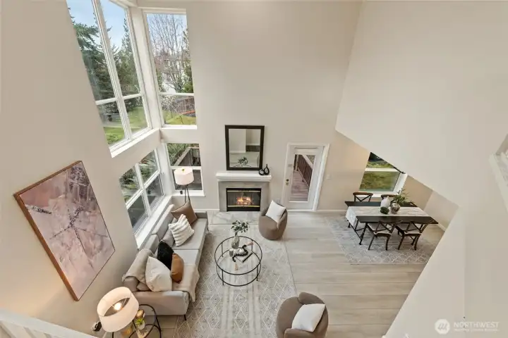 Two story height ceiling with wall windows that fill the living room w/ tons natural light.