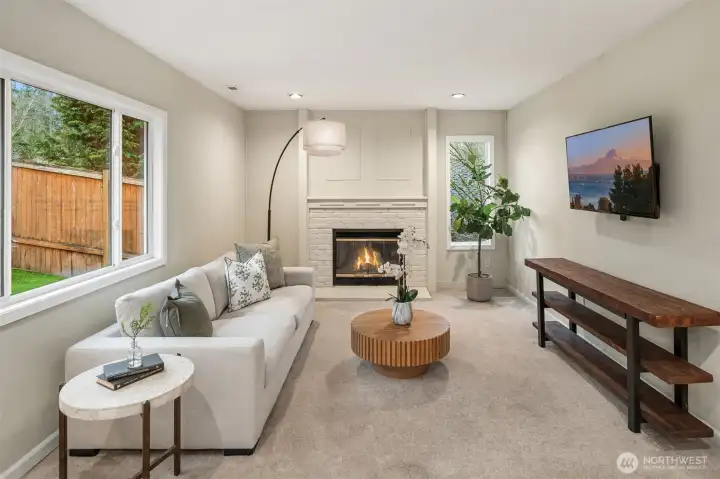 The spacious family room offers flexibility to create a home office, additional bedroom, or bonus space.