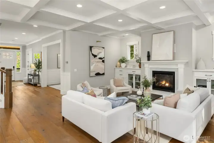The formal living room with built-ins, box-beam ceilings and a cozy propane fireplace.