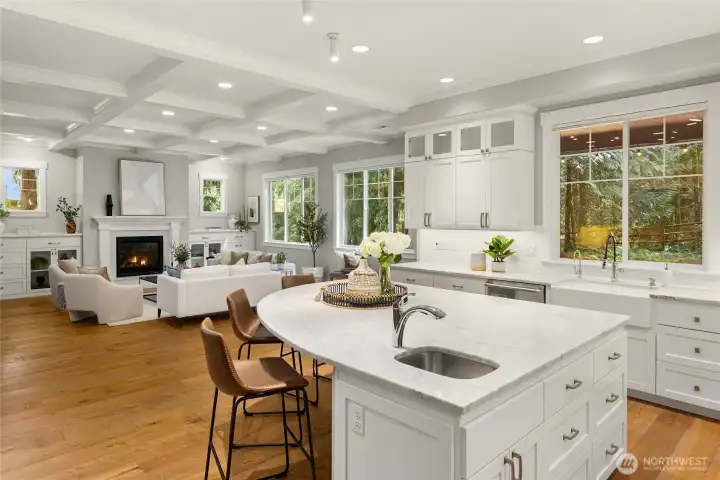 Chef's kitchen with a large island, marble countertops, Viking appliances, wet-bar and walk-in pantry.