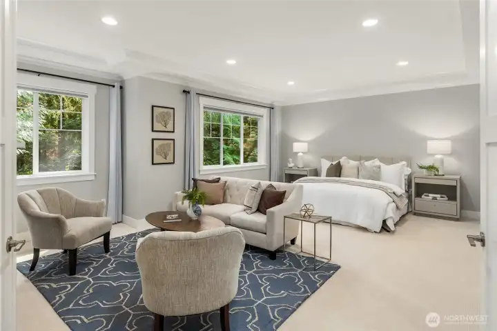 The primary bedroom on the upper level. The entire upper floor has brand new carpeting.