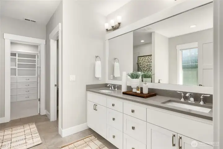 The spa-like 5-piece primary bathroom has dual sinks, a soaking tub and an oversized shower.