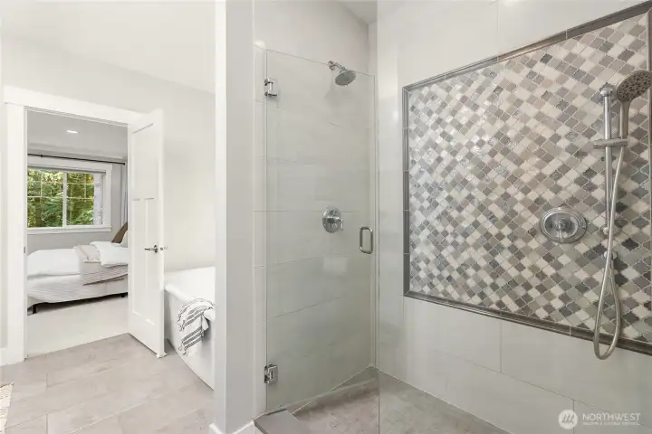 The oversized shower and soaking tub in the primary bathroom.
