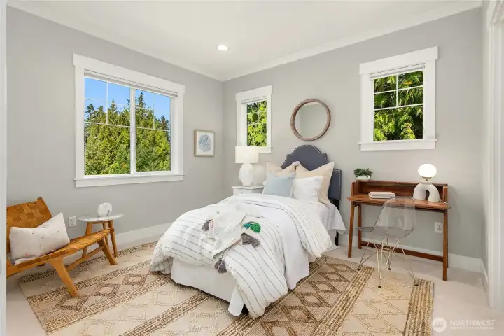 One of four bedrooms on the upper level. All bedrooms have custom closet systems. This home has AMAZING storage.