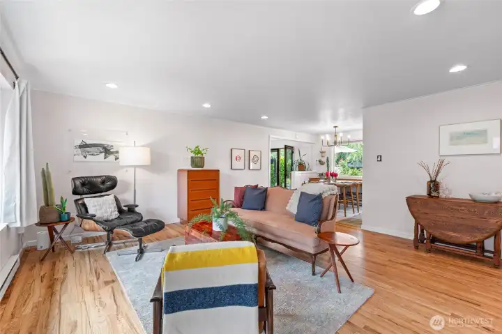 Open-concept living room leads to dining area and kitchen.