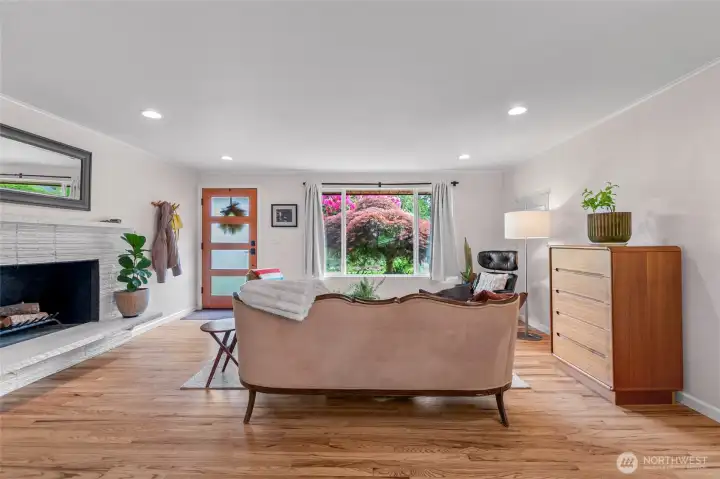 Bright south-facing living room looks out over sweet front garden.