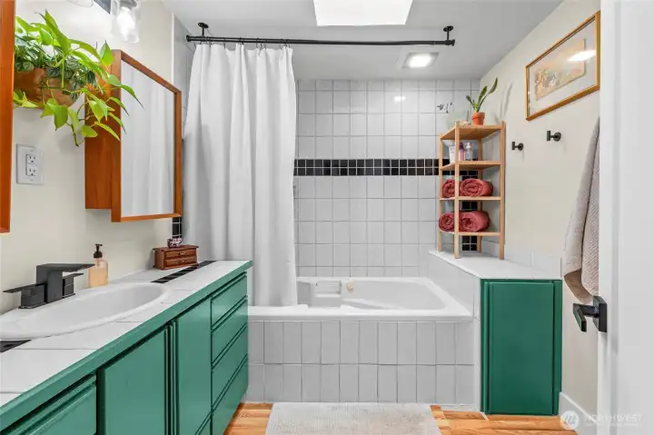 Updated Bathroom bursting with natural light & a glorious deep jetted tub.