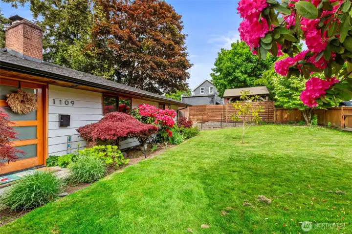 large, south facing front yard with mature landscaping!