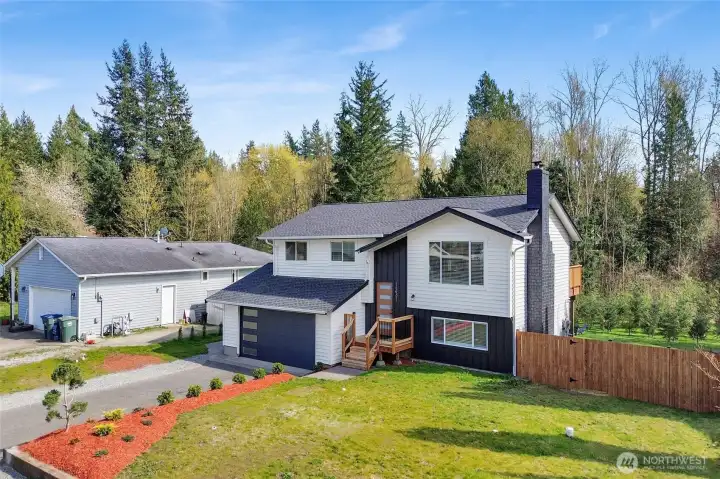 Situated on a large, one of the kind lot with room to enjoy both front and back outdoor spaces!