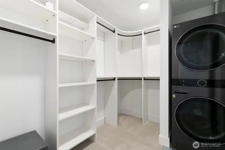 Walk-in closet connects the bedroom to the bathroom.