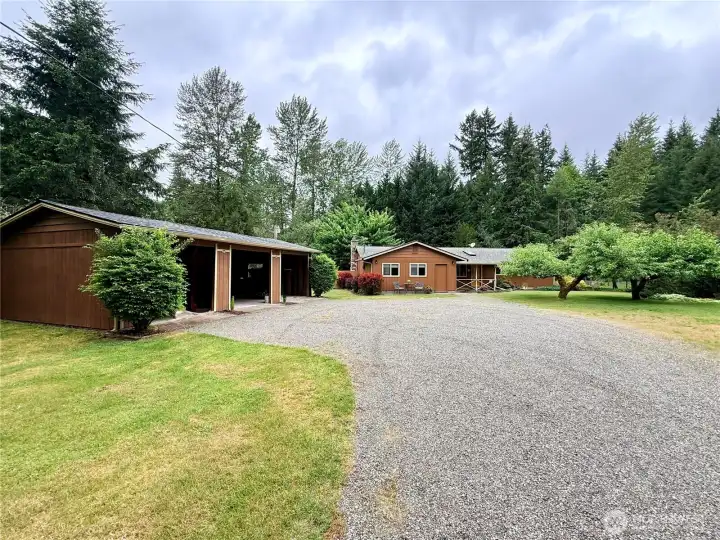 Further back, a look at the front of the home and the carport.
