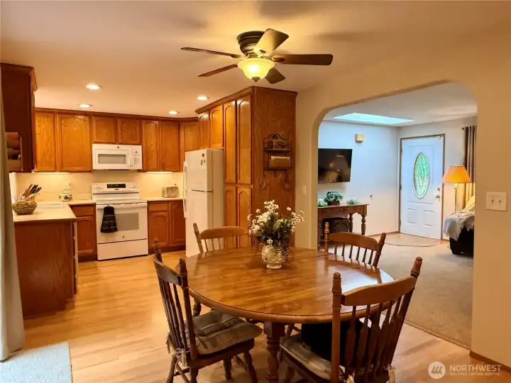 Dining room, with the kitchen and living room around it.