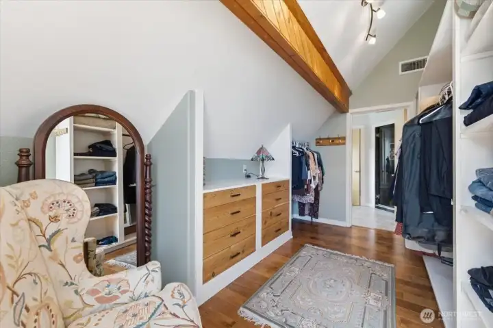 A walk-through closet seamlessly connects the primary suite to the spa-inspired bath. A walk-through closet seamlessly connects the primary suite to the spa-inspired bath.