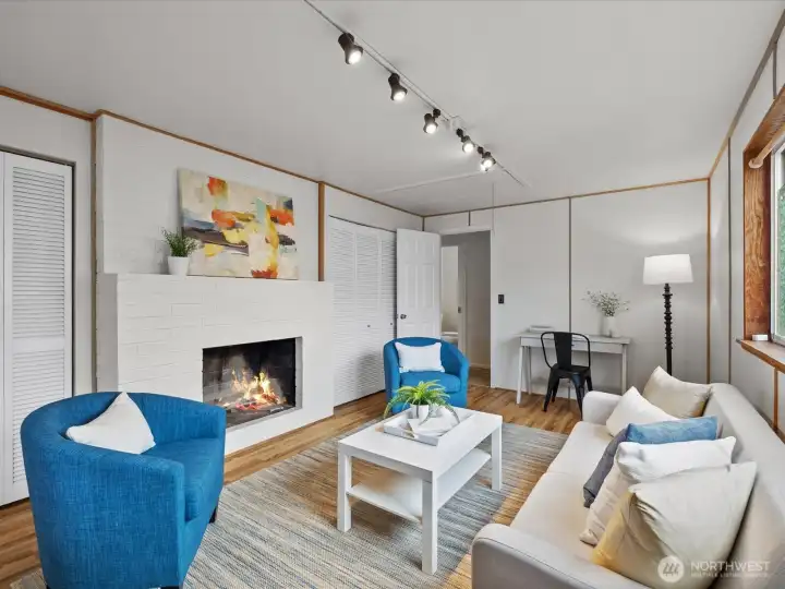 The cozy and comfortable family room with wood burning fireplace.
