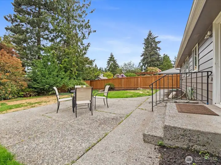 Barbecue sized patio in the fully fenced backyard.