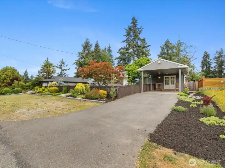 Very generous parking on the long driveway and the parking space in front of the fenced yard.