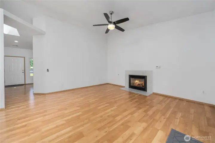 This looks back toward front door from the family room and kitchen space