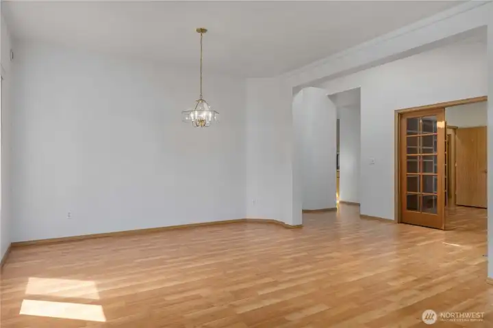 , The living room and dining table area is a spacious blank canvas of possibility.