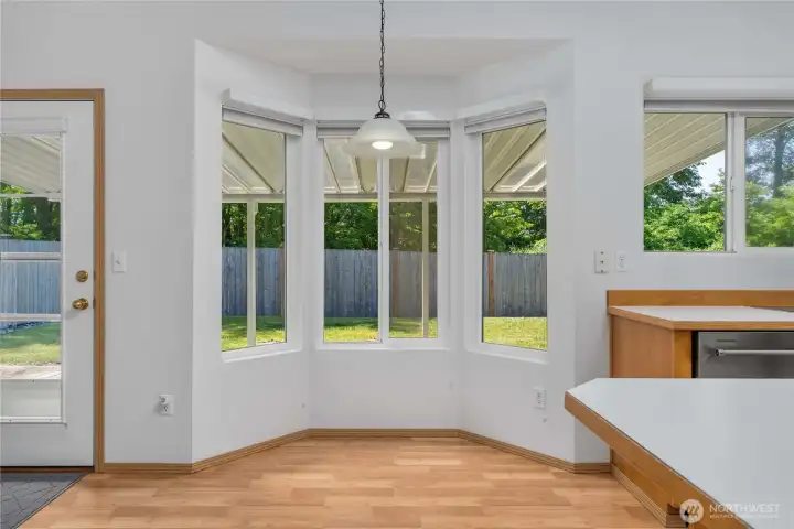 This little bay window, dining nook looks out toward the backyard. There's great light in thi room between windows and skylights.