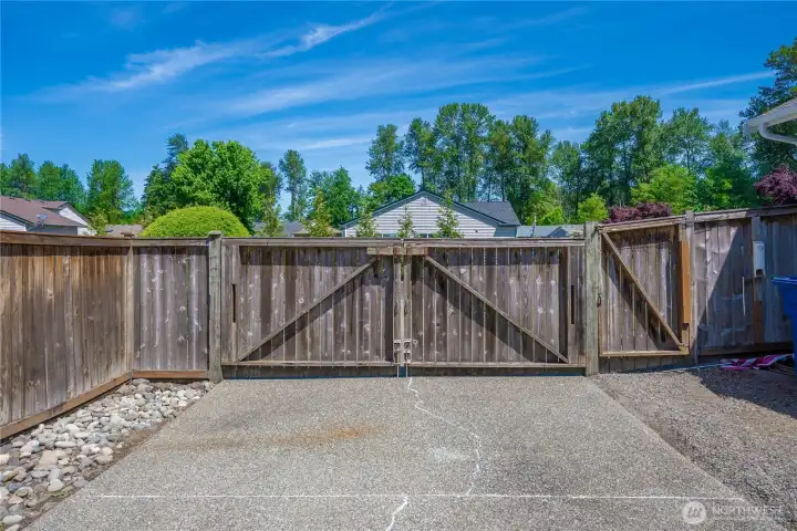The property is gated with the gate set back from the street.