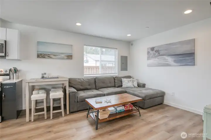 Comfortable living room with sectional, dining table, coffee table and TV. Ready to kick back and relax! Comfortable living room with sectional, dining table, coffee table and TV. Ready to kick back and relax!