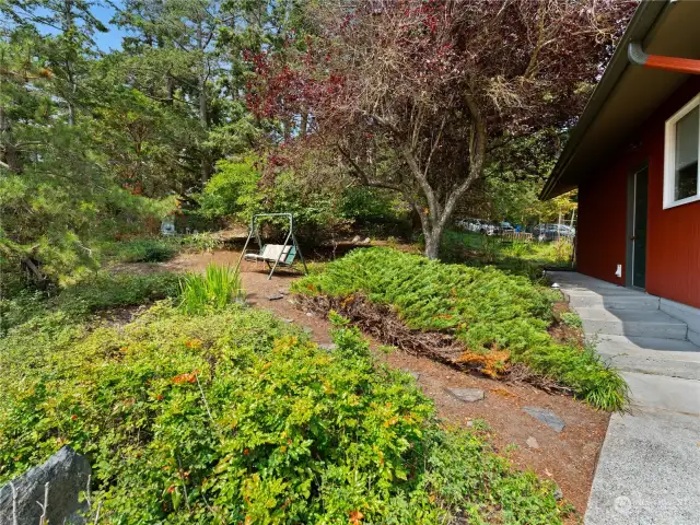 A pretty good-sized fenced garden area from road and alongside the garage.