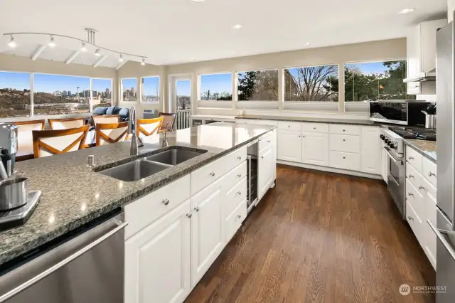 The chefs’ kitchen is designed with entertaining in mind and opens to the dining area, media room, spacious living room with gas fireplace and south facing deck, all with gorgeous views.