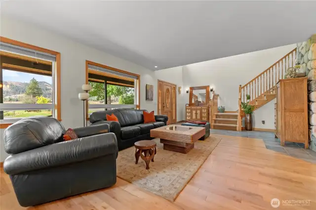 Living room windows connect w scenic beauty of the setting.