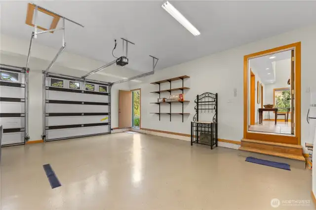 Large garage with floor drain.